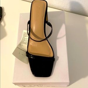 Brand new black heels from The Drop; square toe
